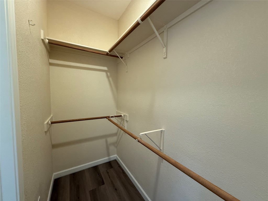 303 Kates Way Hutto, TX 78634 - Photo 6 of 15 a view of storage and utility room with racks on the wall