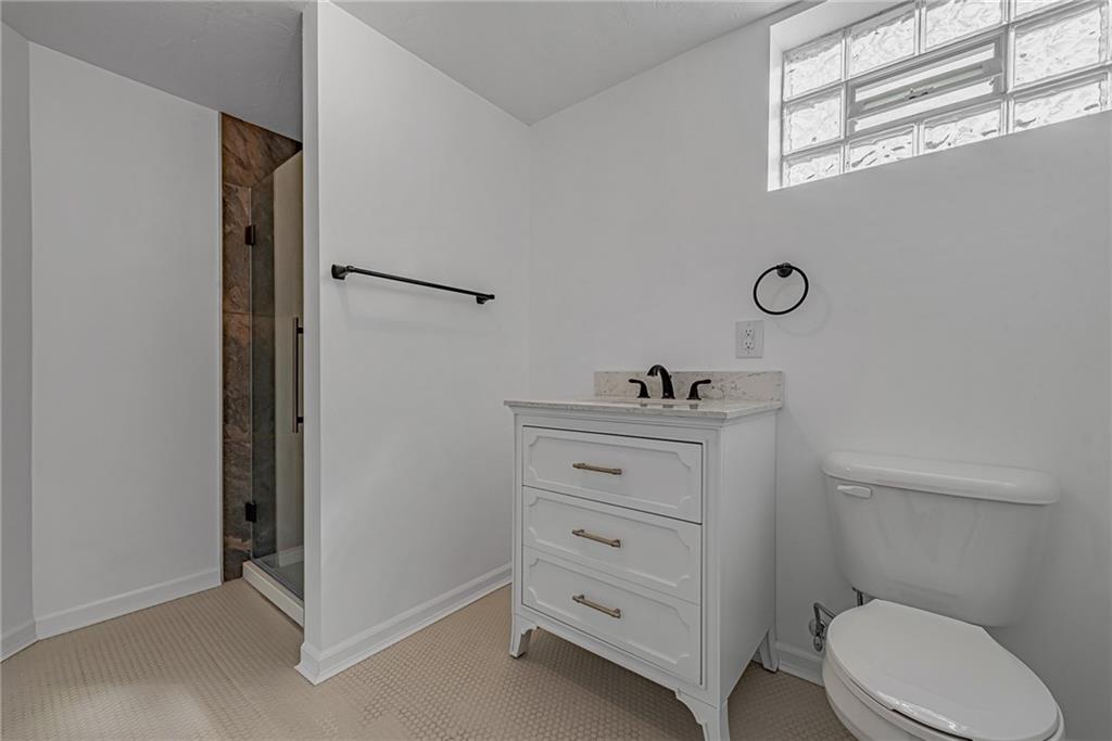 13850 Ridge Road North Huntingdon, PA 15642 - Photo 14 of 21 a bathroom with a sink a toilet and shower