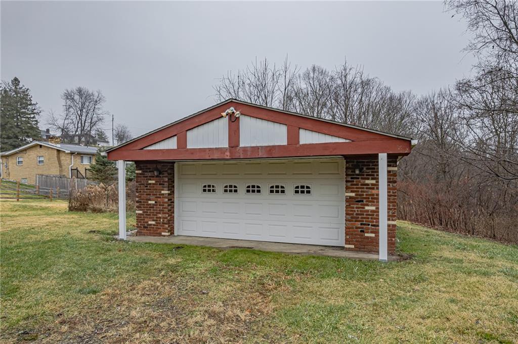 13850 Ridge Road North Huntingdon, PA 15642 - Photo 2 of 21 a front view of a house with garden