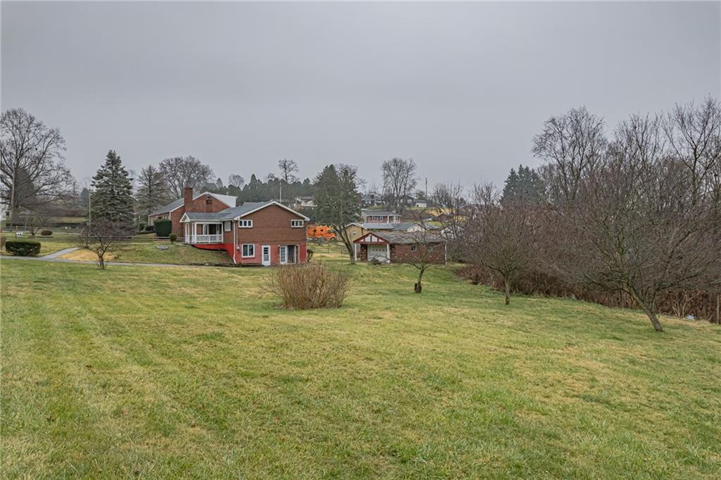 13850 Ridge Road North Huntingdon, PA 15642 - Photo 4 of 21 a view of a house with a yard