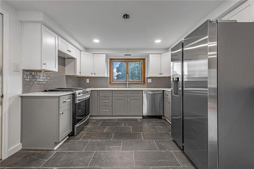 13850 Ridge Road North Huntingdon, PA 15642 - Photo 5 of 21 a kitchen with a sink stainless steel appliances and cabinets