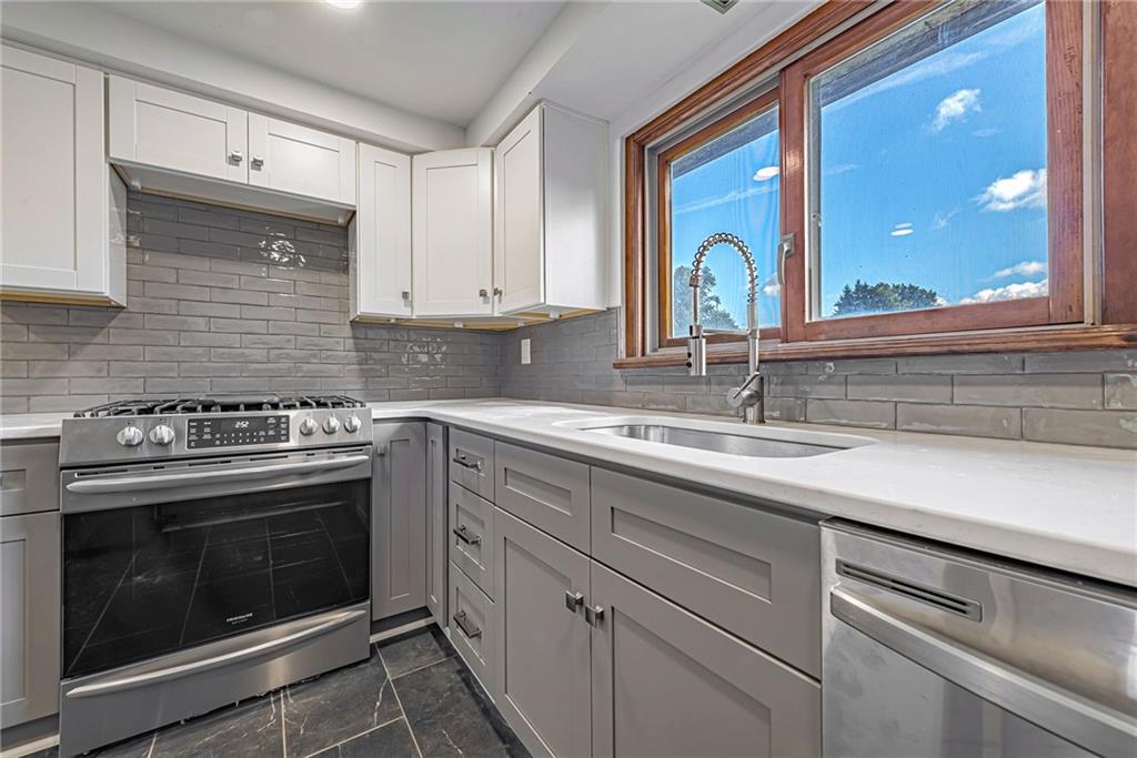 13850 Ridge Road North Huntingdon, PA 15642 - Photo 6 of 21 a kitchen with a stove oven and sink