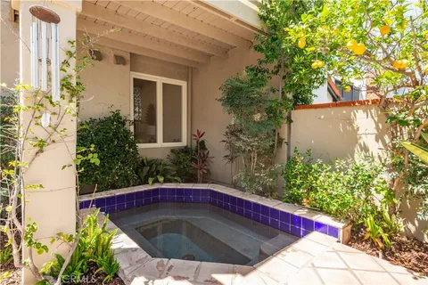 an aerial view of a residential house with outdoor space