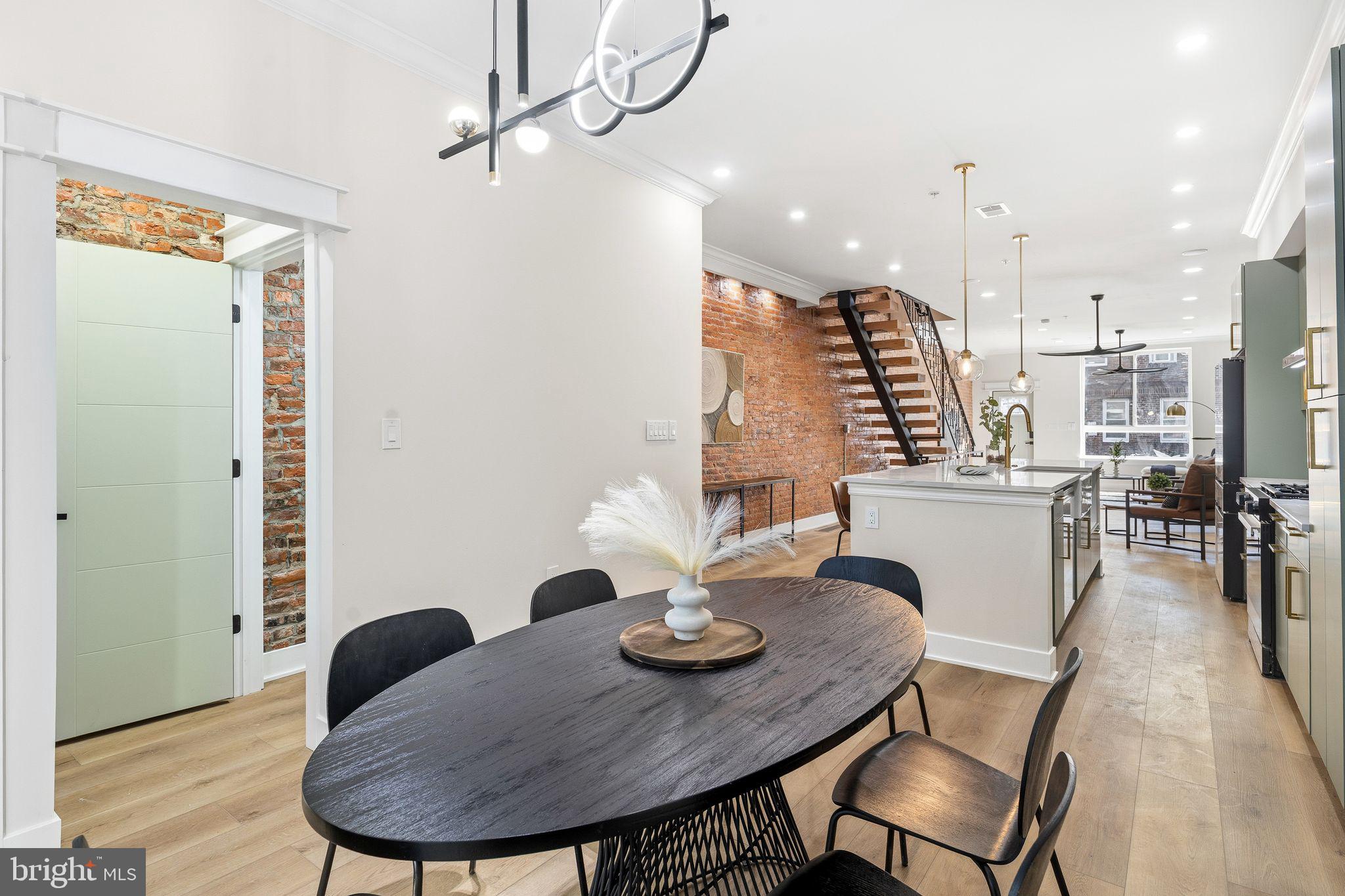 1731 Reed Street Philadelphia, PA 19146 - Photo 11 of 42 a view of a dining room with furniture and wooden floor