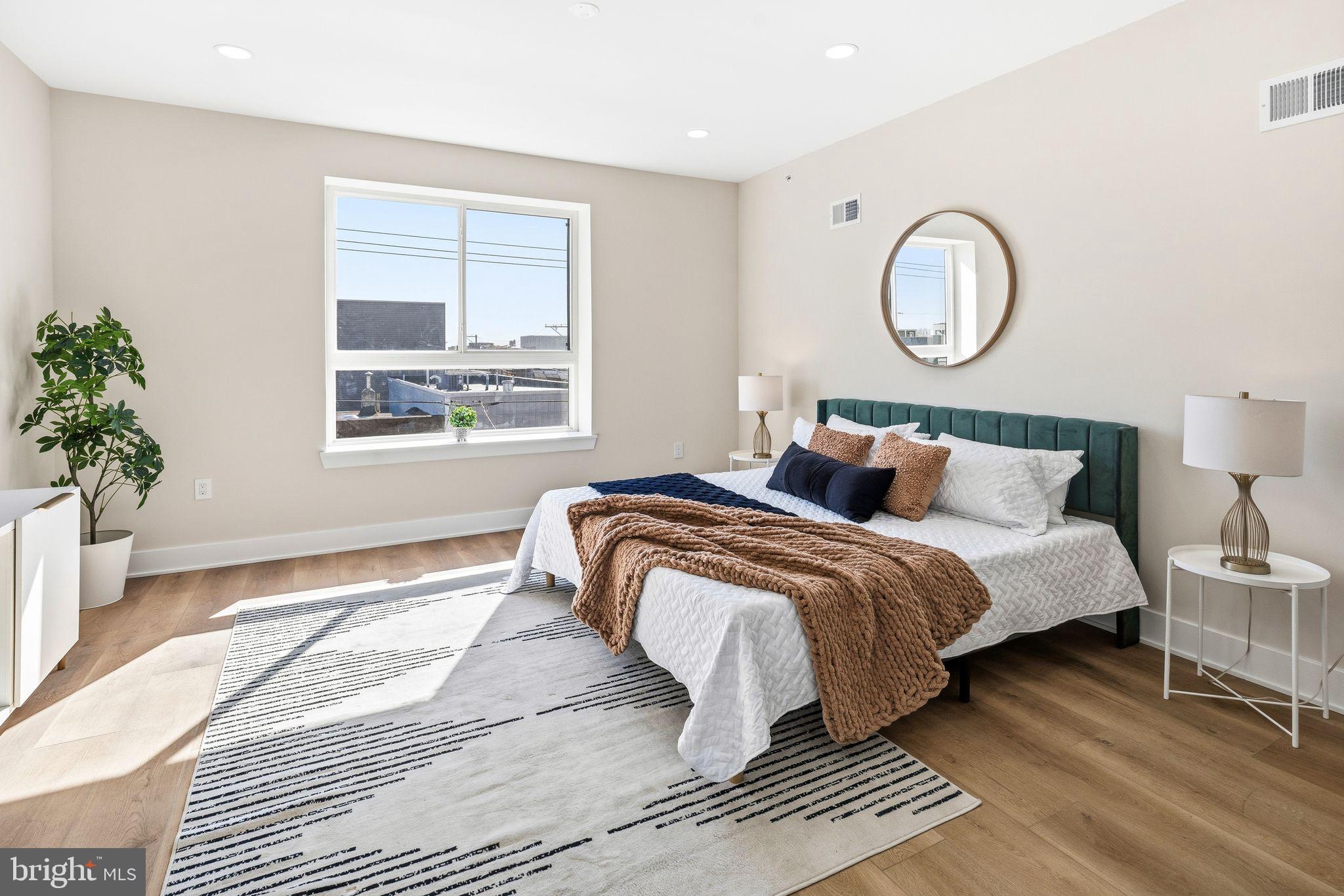 1731 Reed Street Philadelphia, PA 19146 - Photo 15 of 42 a bedroom with bed and a window