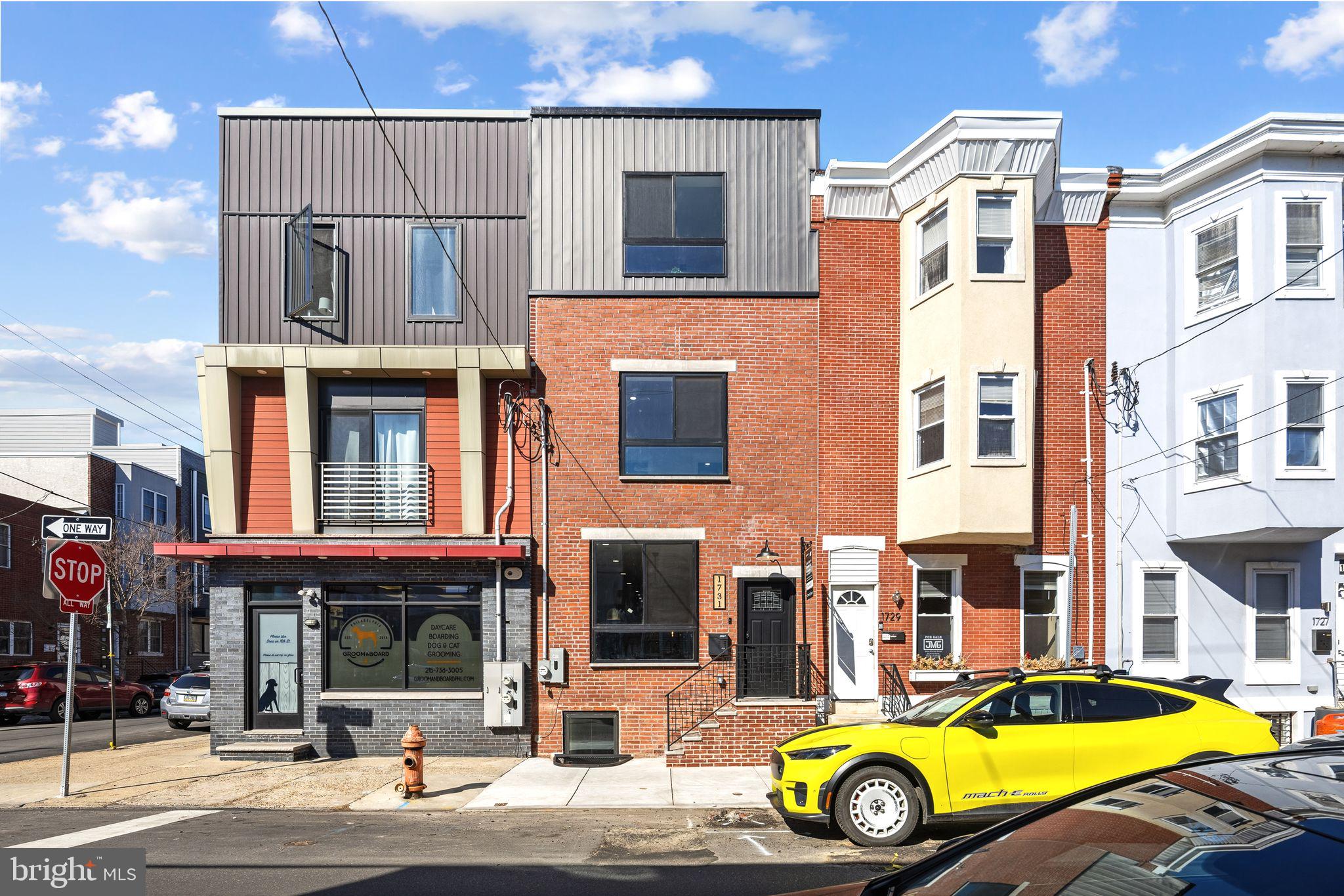 1731 Reed Street Philadelphia, PA 19146 - Photo 2 of 42 a view of a building with car parked