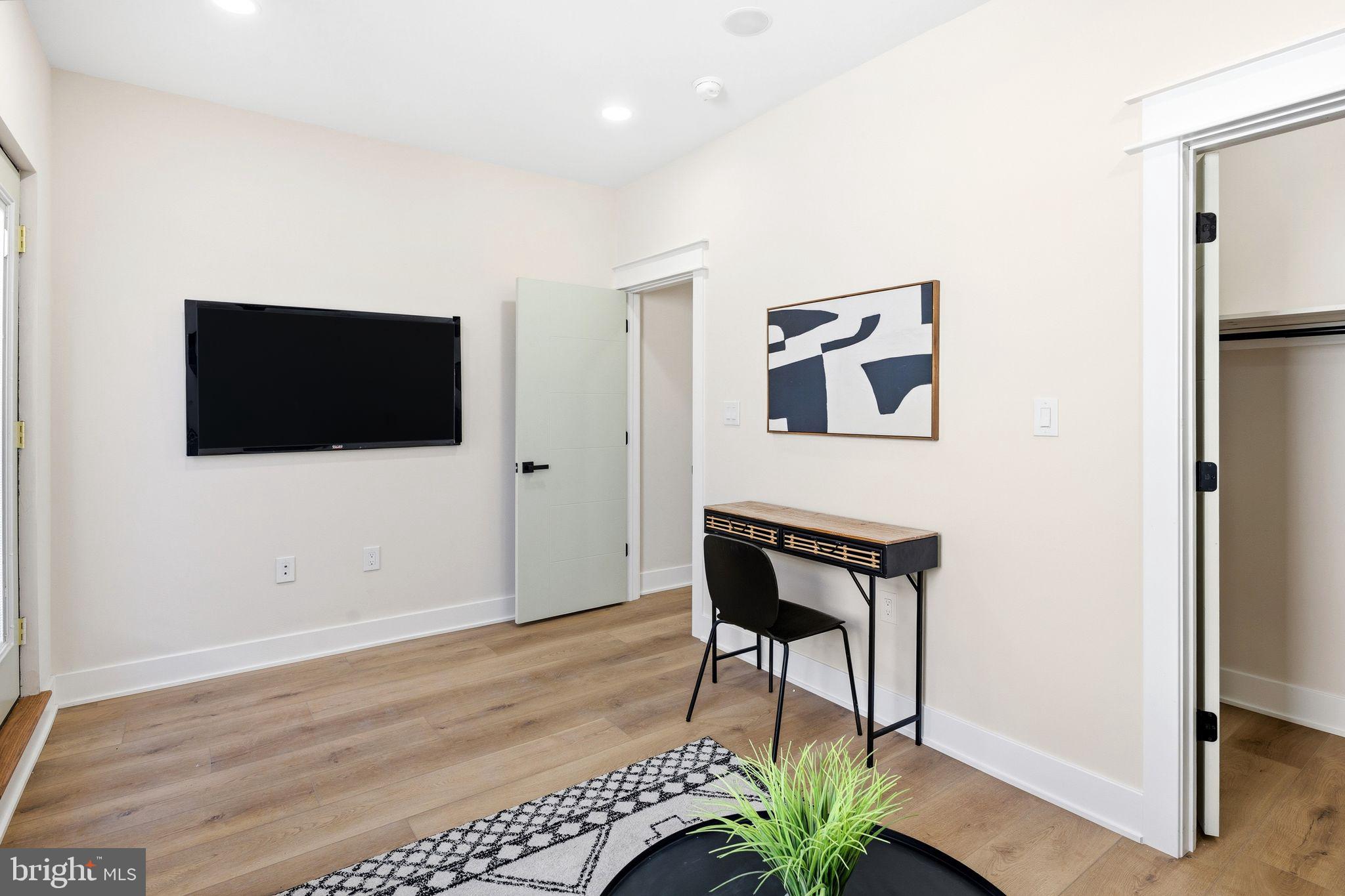 1731 Reed Street Philadelphia, PA 19146 - Photo 25 of 42 a living room with furniture and a flat screen tv