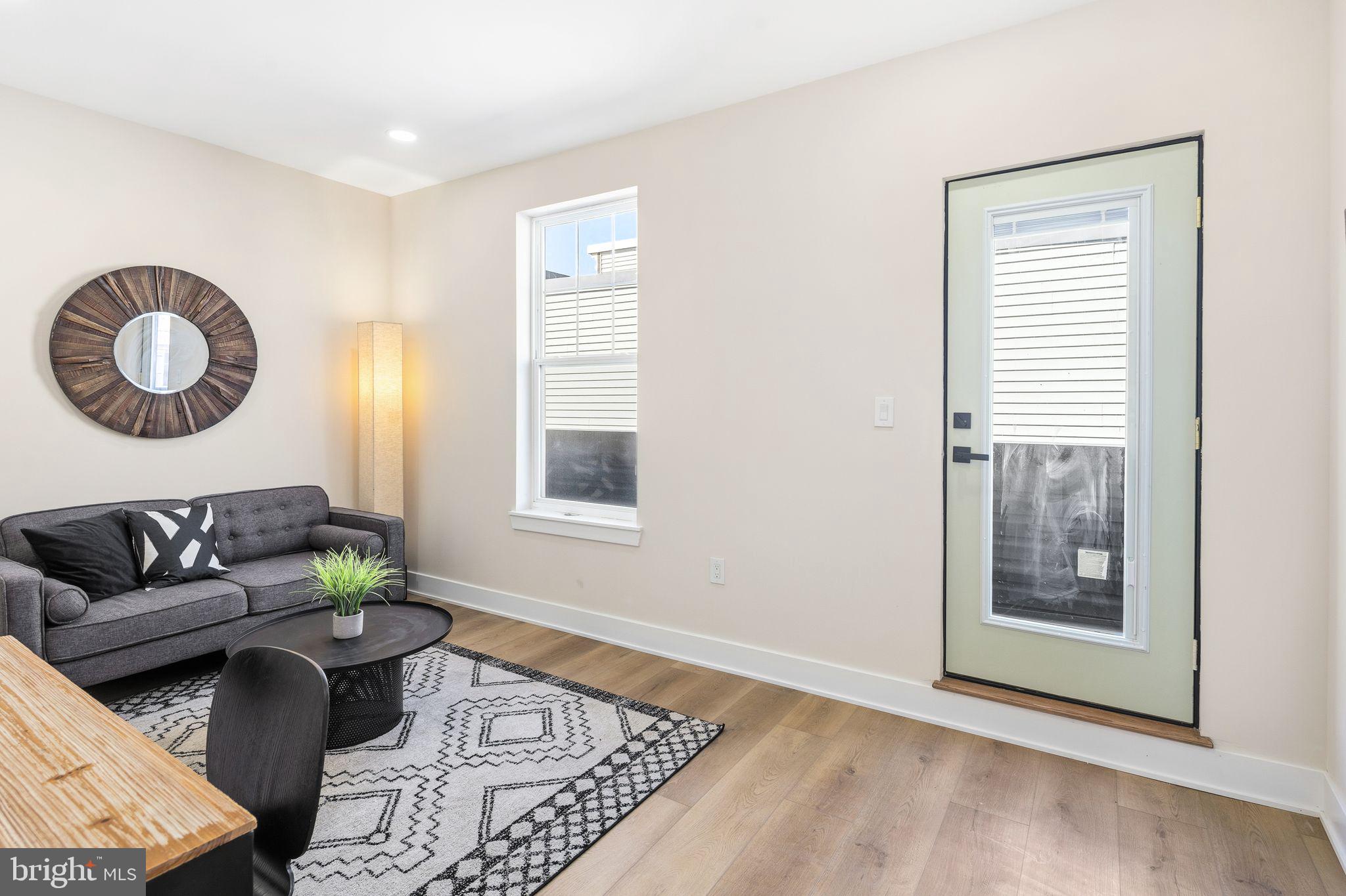 1731 Reed Street Philadelphia, PA 19146 - Photo 26 of 42 a living room with furniture and a window