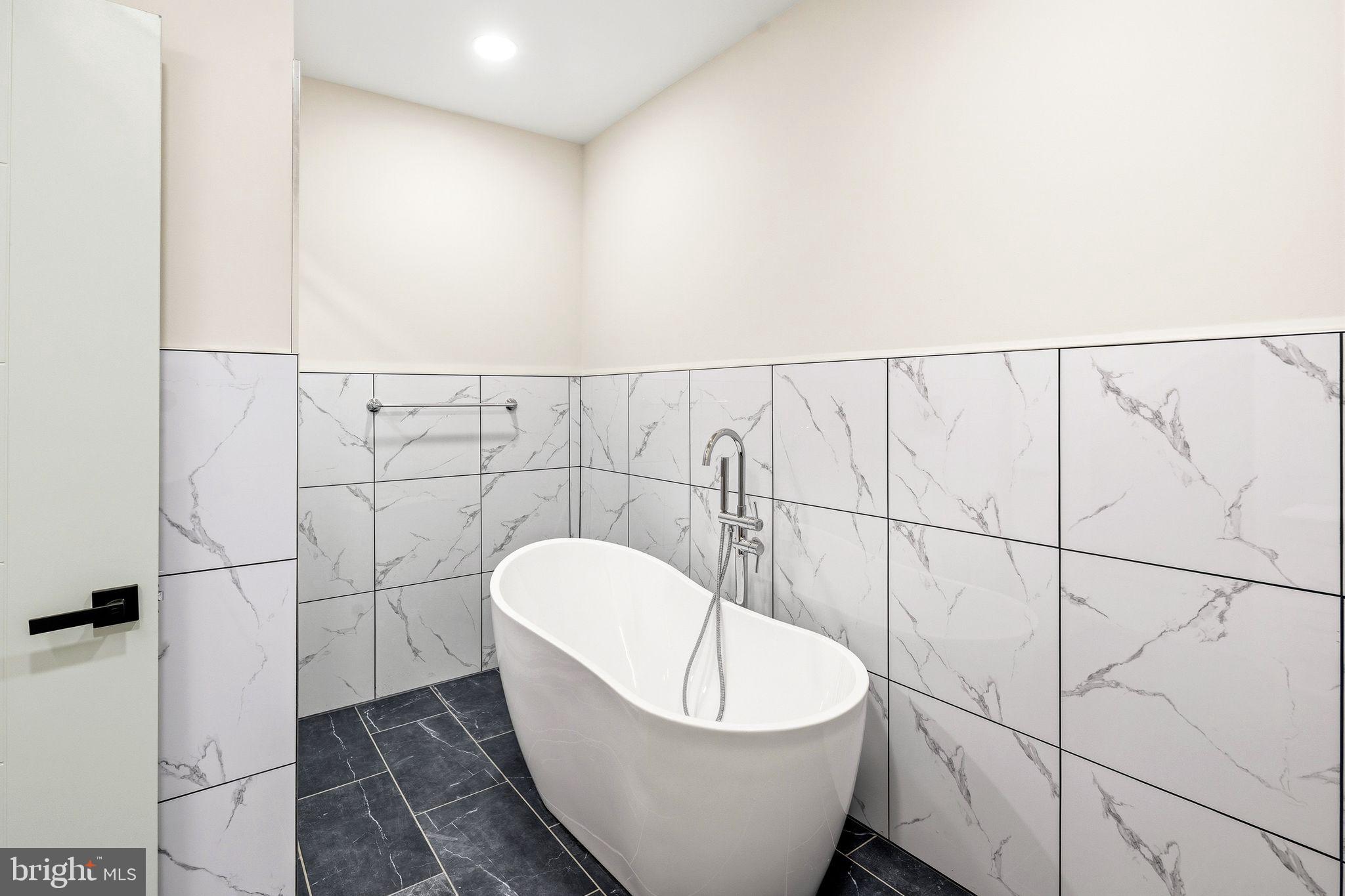 1731 Reed Street Philadelphia, PA 19146 - Photo 31 of 42 a bathroom with a bathtub and shower