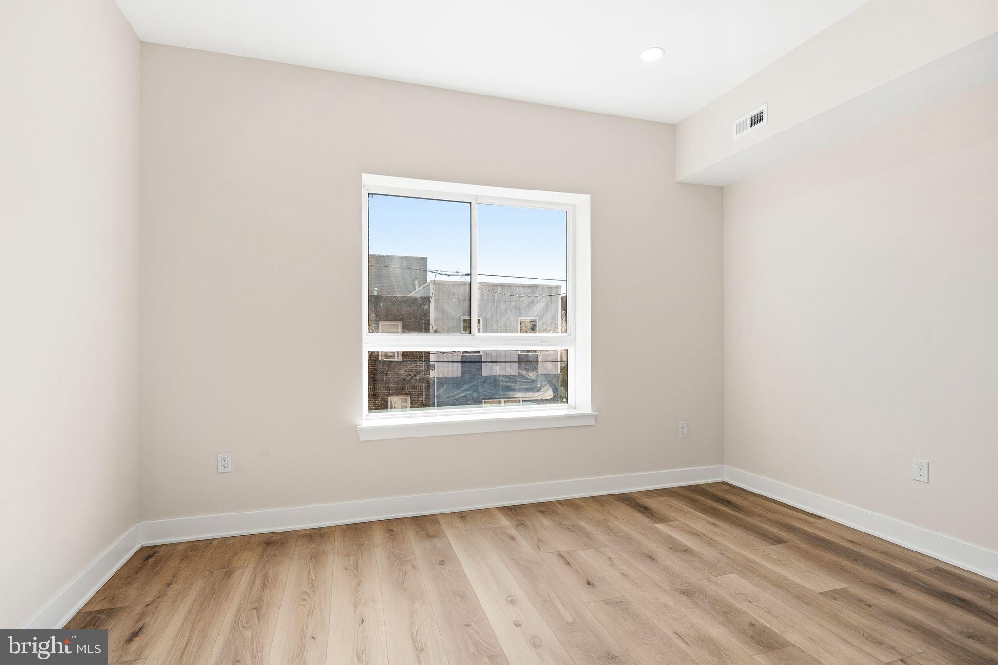 1731 Reed Street Philadelphia, PA 19146 - Photo 32 of 42 an empty room with a window