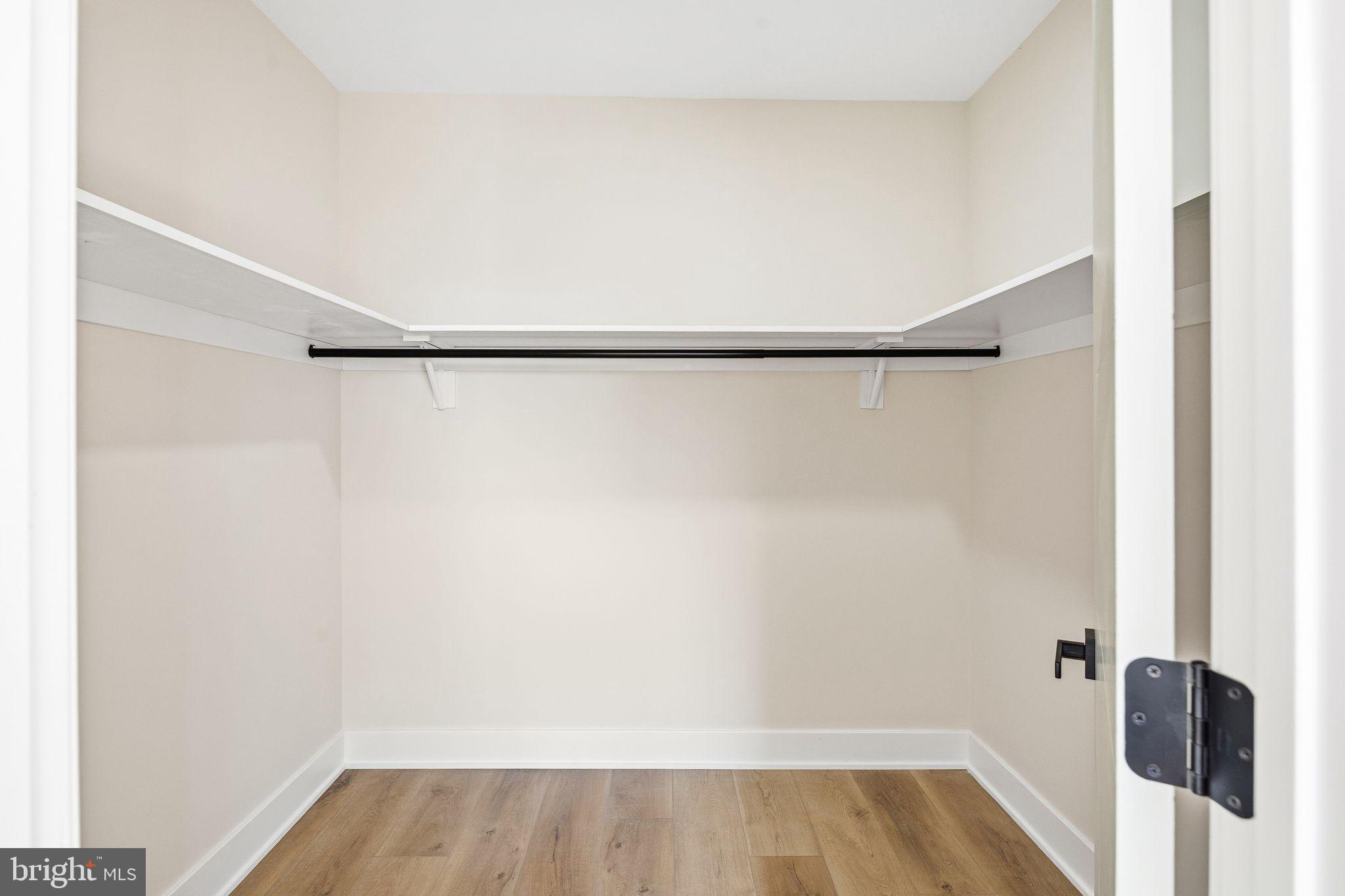 1731 Reed Street Philadelphia, PA 19146 - Photo 34 of 42 a view of walk in closet with wooden floor