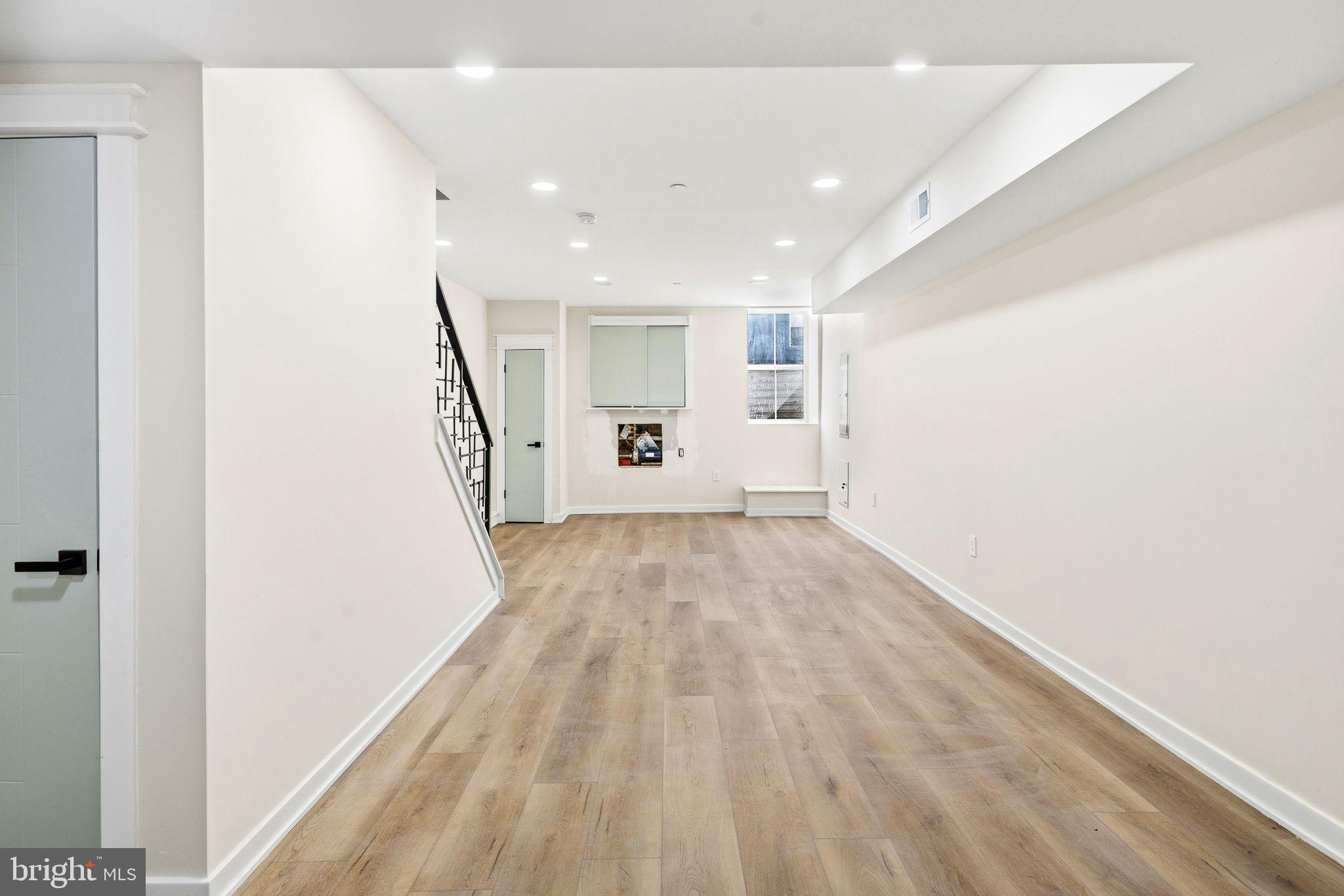1731 Reed Street Philadelphia, PA 19146 - Photo 40 of 42 a view of a hallway with wooden floor