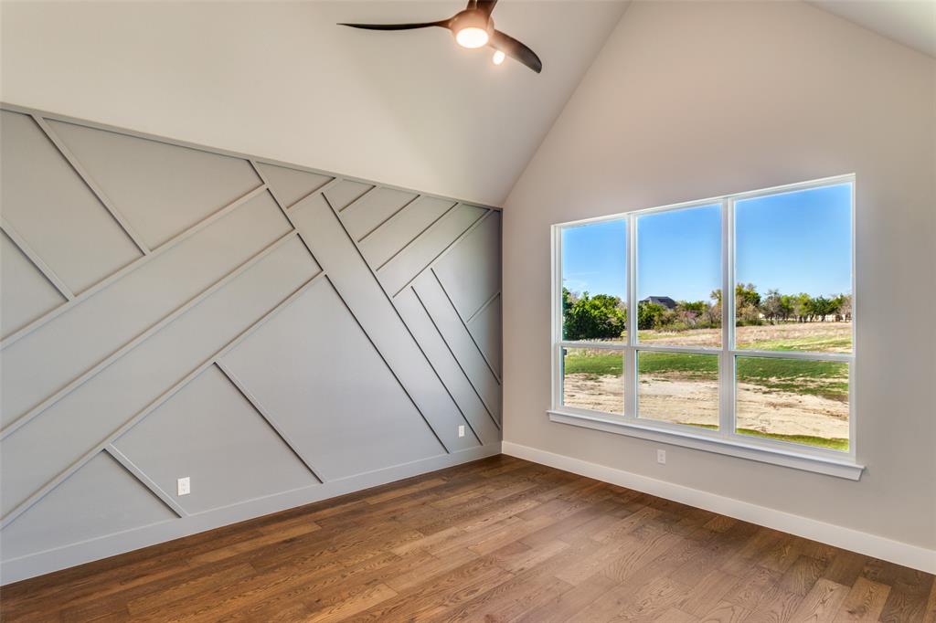 555 Aermotor Loop Weatherford, TX 76085 - Photo 18 of 30 an empty room with wooden floor and windows
