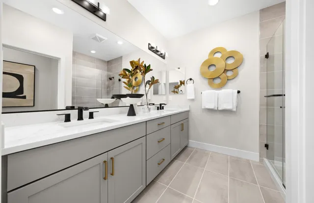 a spacious bathroom with a sink mirror and vanity