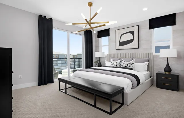 a spacious bedroom with a bed and glass wall