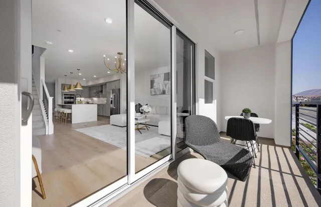 a living room with furniture and a large mirror