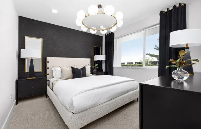 a bedroom with bed and window