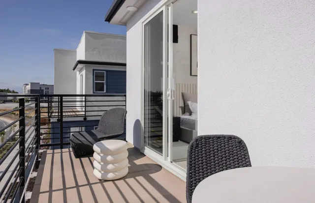 a view of a balcony with wooden floor