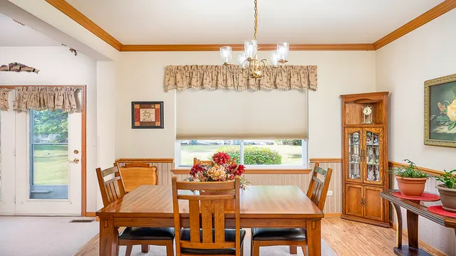 a view of a dining room with furniture window and outside view