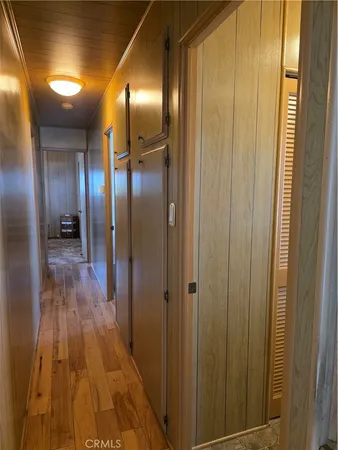 a bathroom with a glass door shower and a mirror