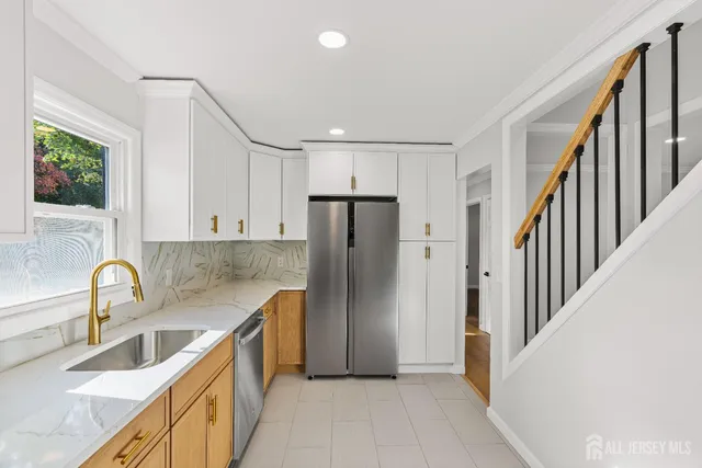 a view of an empty room and wooden floor