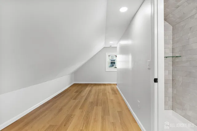 a front view of house with yard and trees in the background