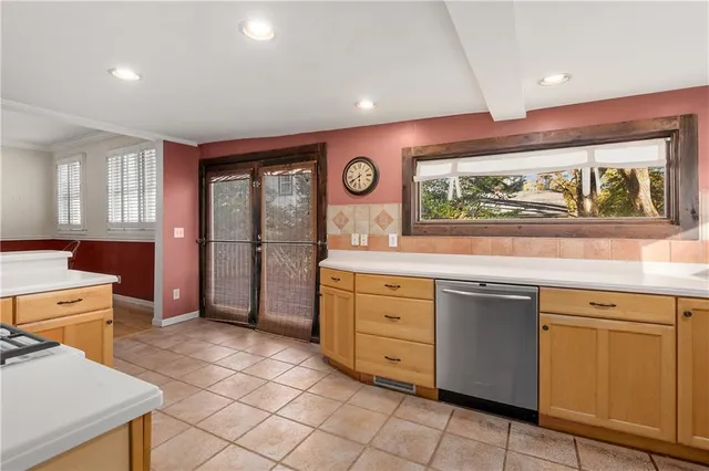 a kitchen with granite countertop a stove and a sink