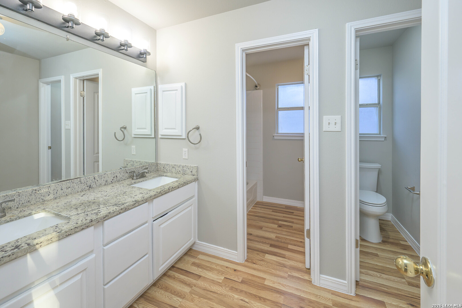 16558 Redland Ranch San Antonio, TX 78247 - Photo 12 of 17 a bathroom with a granite countertop sink and a mirror