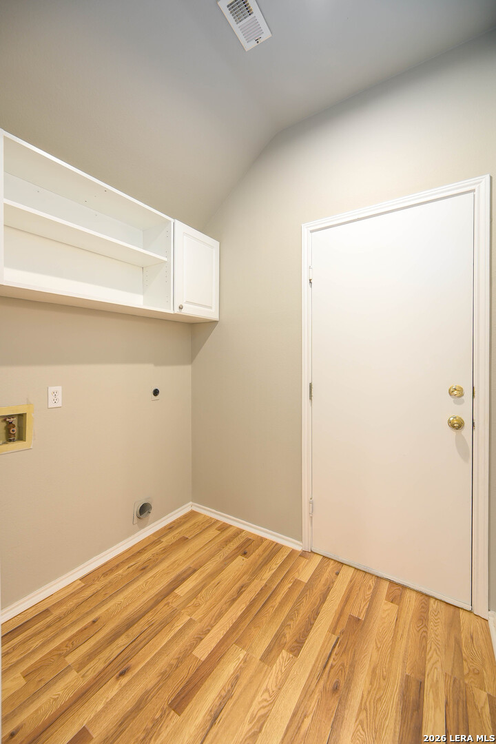 16558 Redland Ranch San Antonio, TX 78247 - Photo 13 of 17 a view of a room with wooden floor