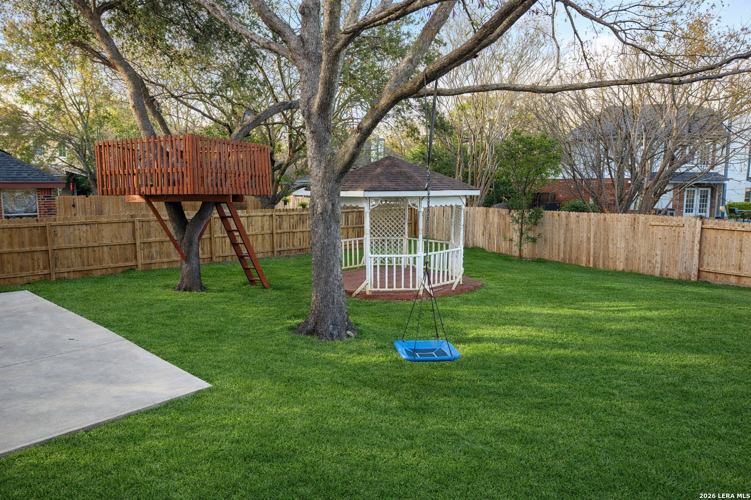 16558 Redland Ranch San Antonio, TX 78247 - Photo 15 of 17 a view of a house with backyard and a tree