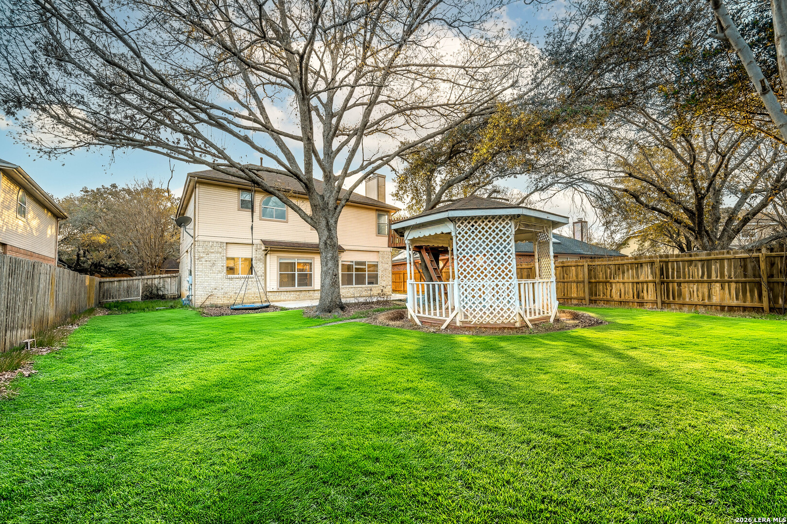 16558 Redland Ranch San Antonio, TX 78247 - Photo 16 of 17 a view of a house with a yard