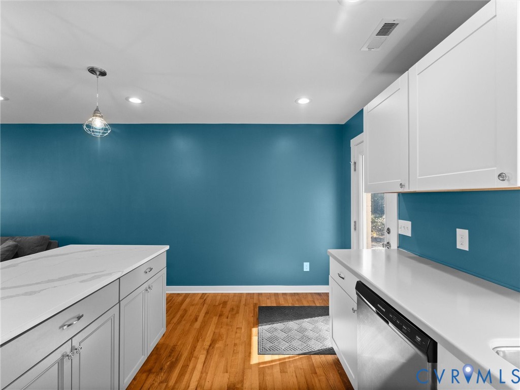 408 Howerton Road Tappahannock, VA 22560 - Photo 20 of 49 Kitchen featuring wood-finish flooring, white coun