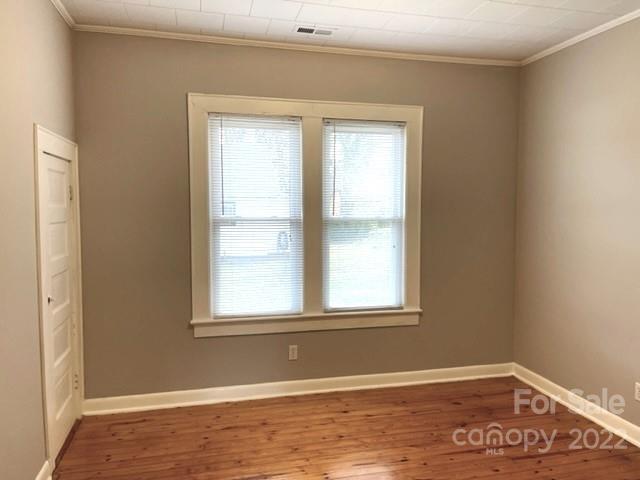 449 15th Street Southwest Hickory, NC 28602 - Photo 11 of 11 a view of an empty room with wooden floor and a window
