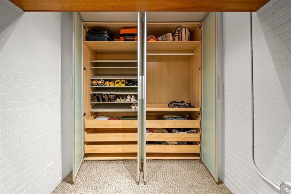 70 Exchange Street, Unit 206 Lynn, MA 01901 - Photo 14 of 40 a view of walk in closet with empty racks