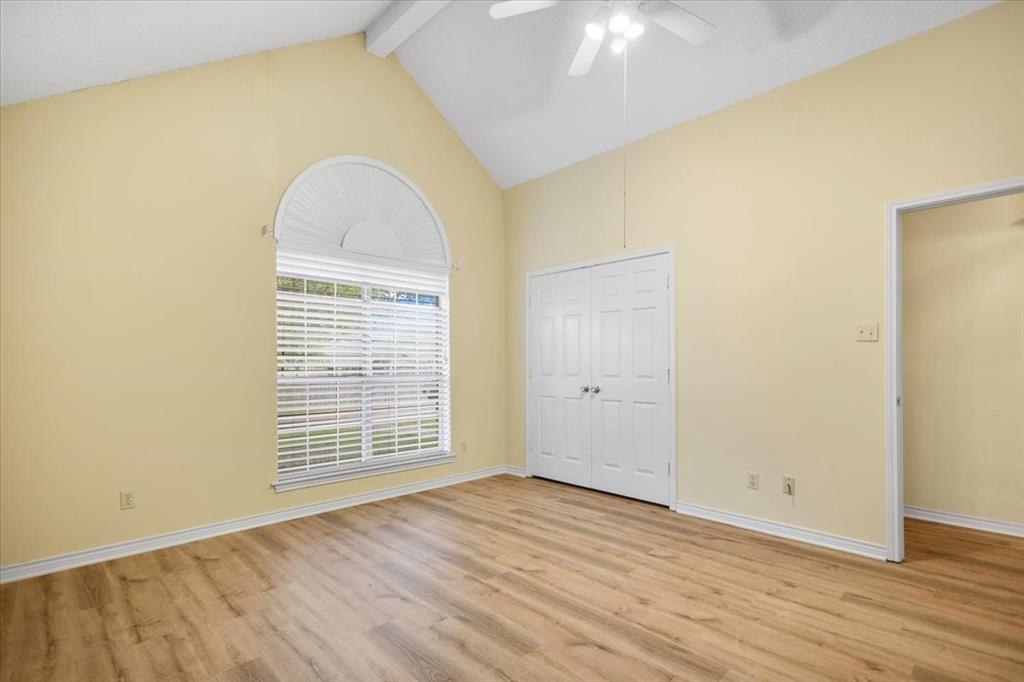 2824 Crestview Avenue Tyler, TX 75701 - Photo 27 of 39 a view of an empty room with wooden floor and a window