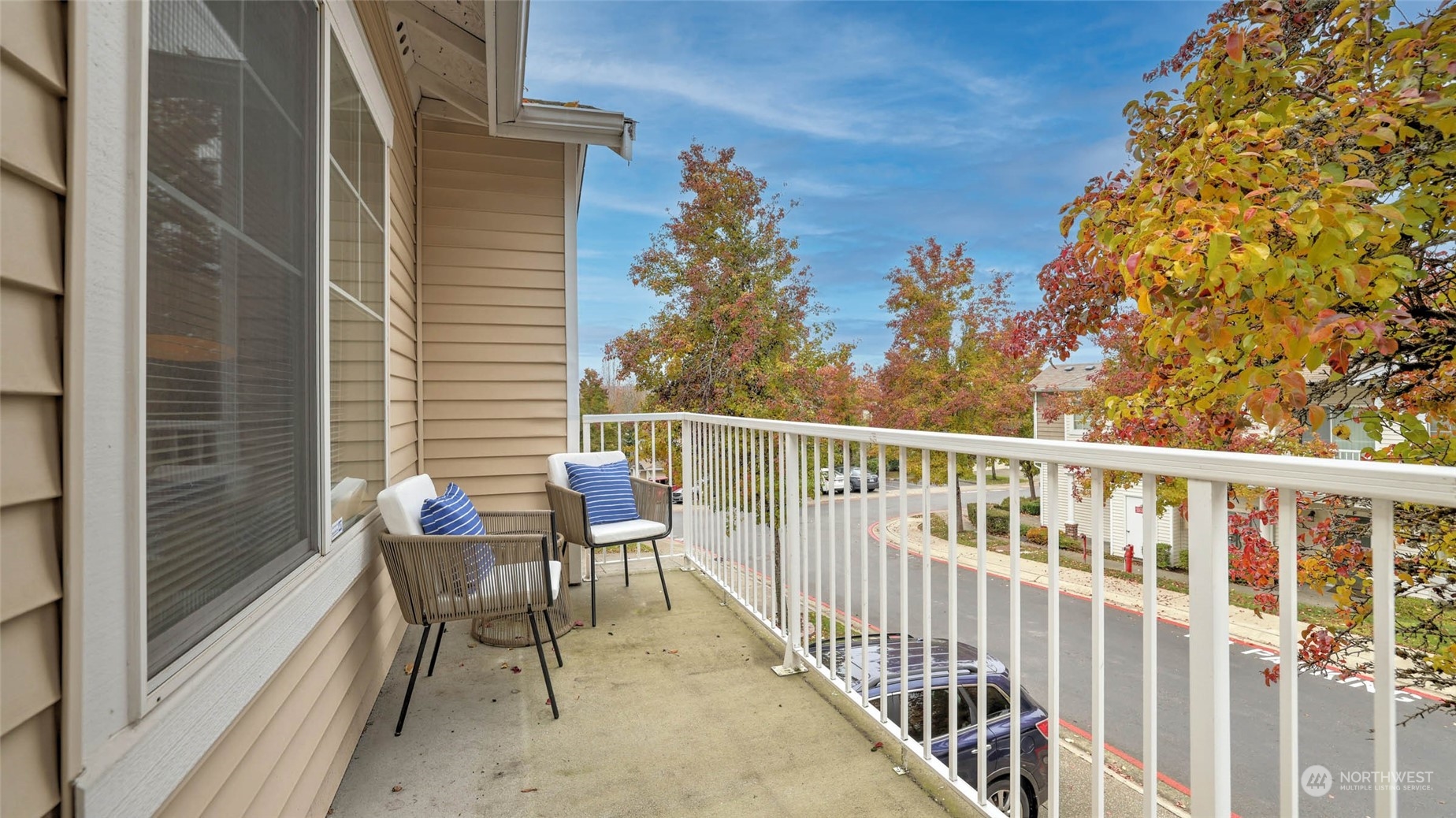 217 South 49th Street, Unit B Renton, WA 98055 - Photo 11 of 16 a view of a chair and table in the balcony