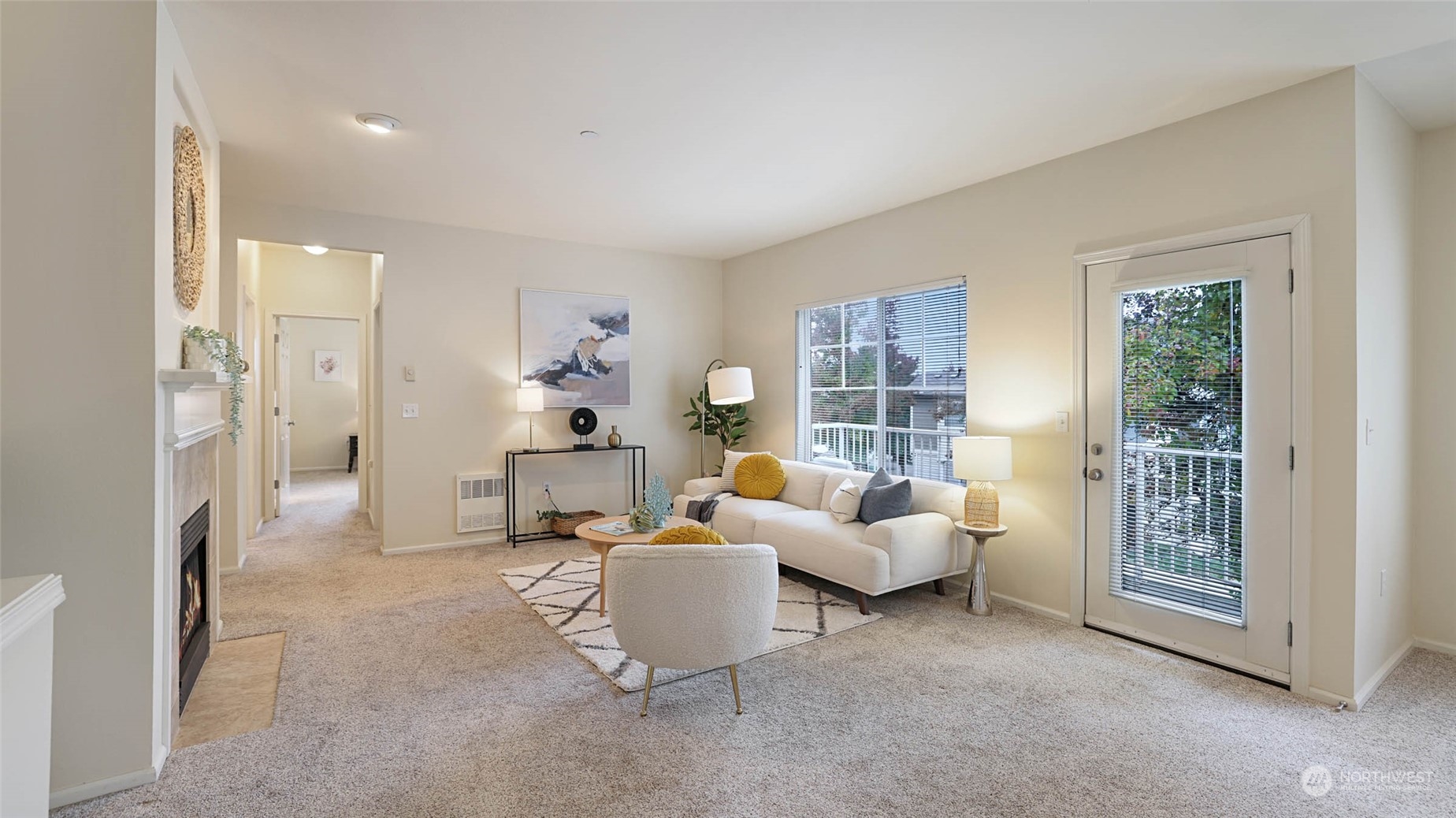 217 South 49th Street, Unit B Renton, WA 98055 - Photo 2 of 16 a living room with furniture and a fireplace