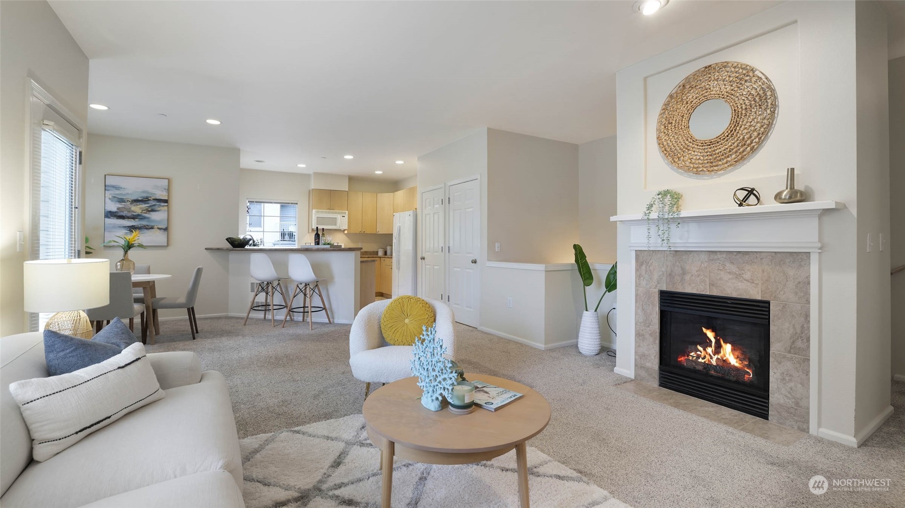 217 South 49th Street, Unit B Renton, WA 98055 - Photo 3 of 16 a living room with furniture a fireplace and a fireplace