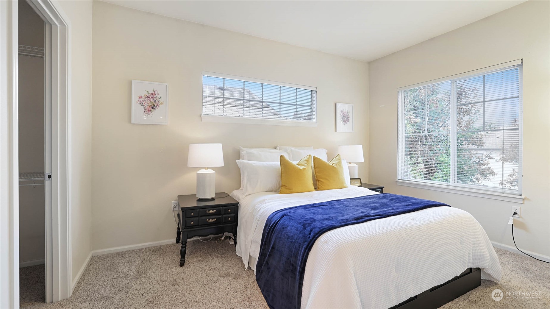 217 South 49th Street, Unit B Renton, WA 98055 - Photo 7 of 16 a bedroom with a bed and a window