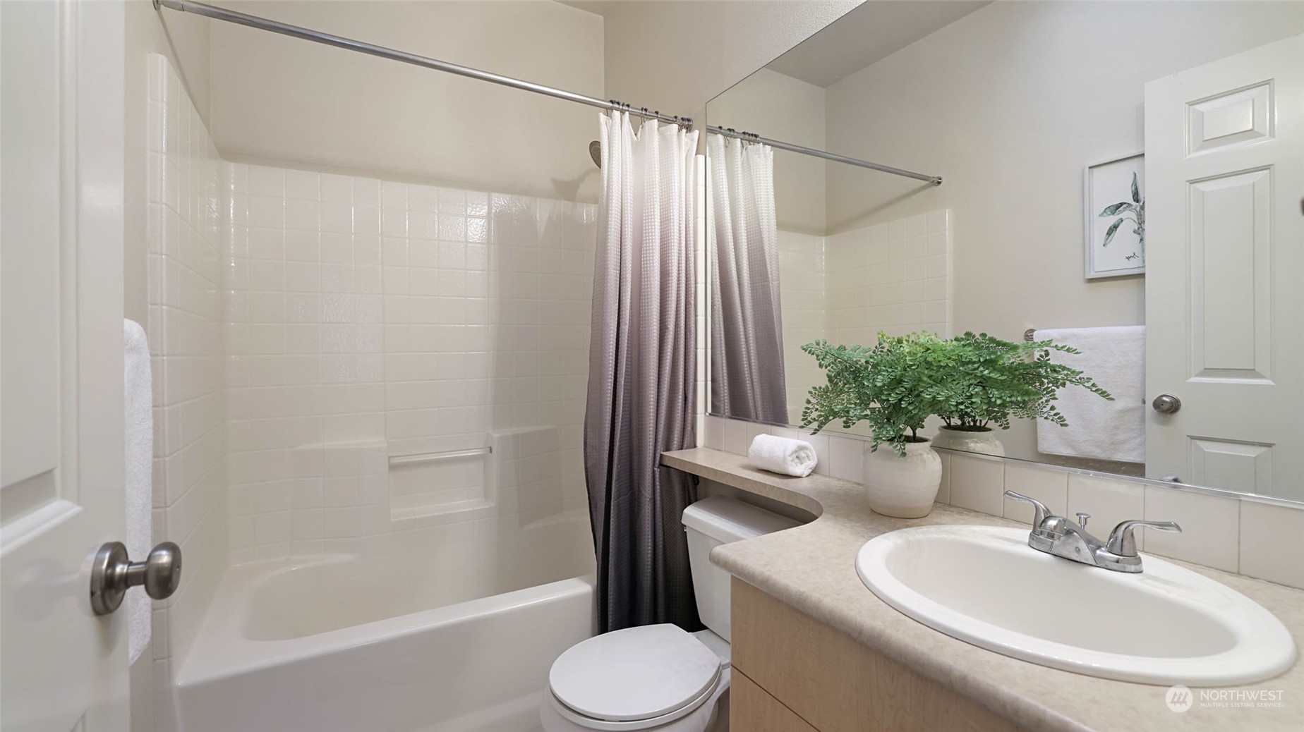 217 South 49th Street, Unit B Renton, WA 98055 - Photo 10 of 16 a bathroom with a sink toilet and shower
