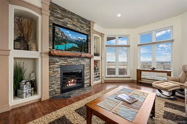 a kitchen with granite countertop wooden cabinets stainless steel appliances and a sink