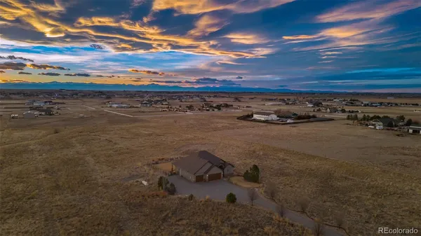 an aerial view of a house with outdoor space