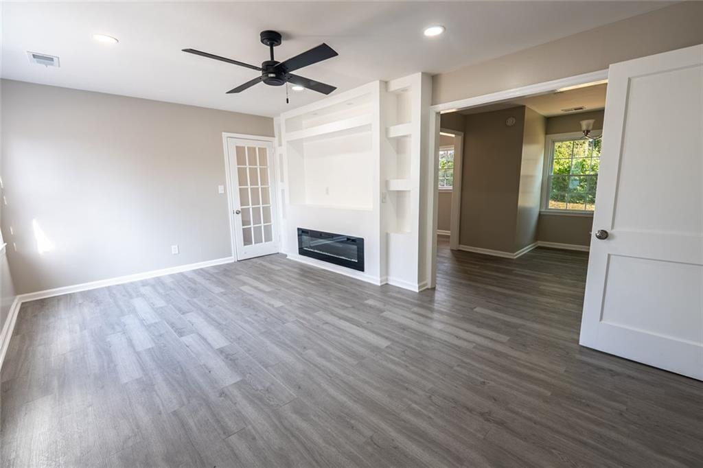 3122 Semmes Street Atlanta, GA 30344 - Photo 13 of 33 a view of empty room with wooden floor and ceiling fan