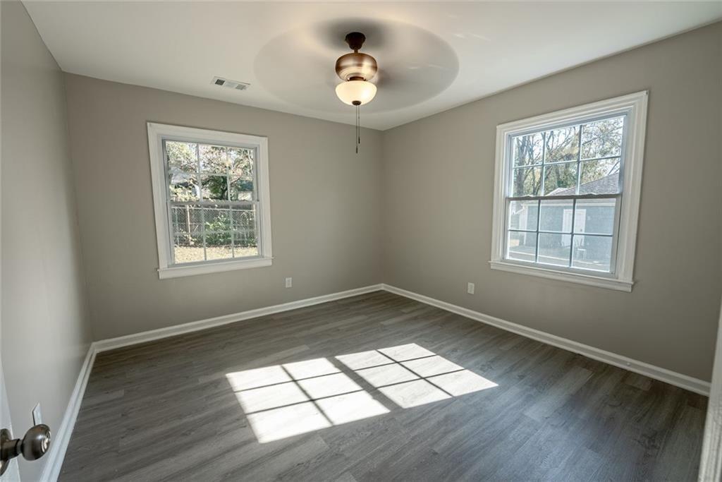 3122 Semmes Street Atlanta, GA 30344 - Photo 16 of 33 a view of empty room with wooden floor and fan