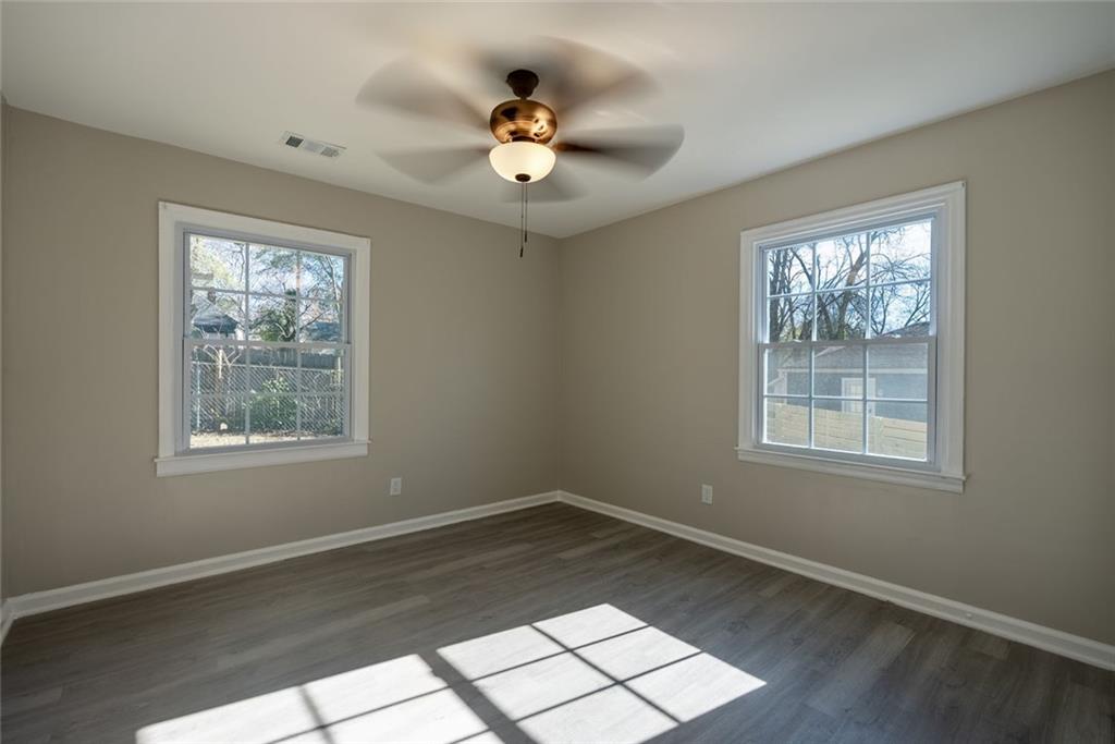 3122 Semmes Street Atlanta, GA 30344 - Photo 17 of 33 a view of an empty room with wooden floor and a window