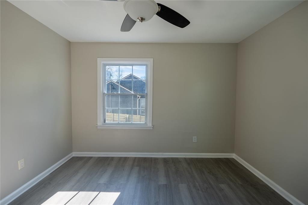 3122 Semmes Street Atlanta, GA 30344 - Photo 19 of 33 an empty room with wooden floor and windows