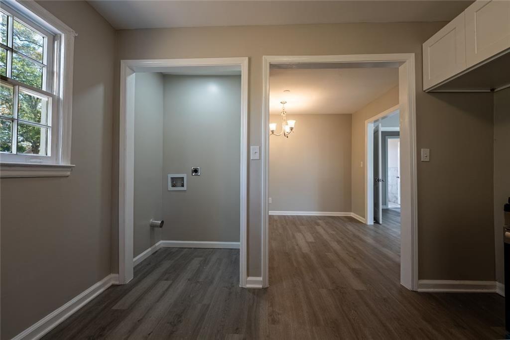 3122 Semmes Street Atlanta, GA 30344 - Photo 26 of 33 an empty room with wooden floor and windows
