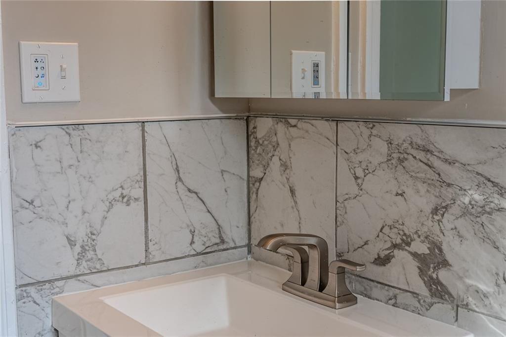 3122 Semmes Street Atlanta, GA 30344 - Photo 27 of 33 a bathroom with a sink and mirror