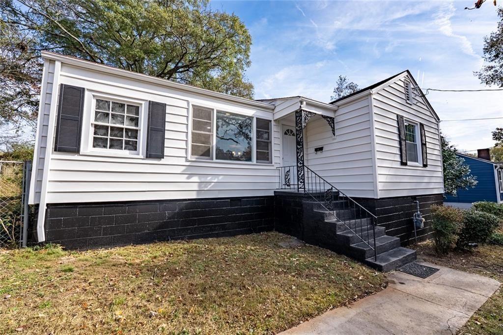 3122 Semmes Street Atlanta, GA 30344 - Photo 3 of 33 a front view of a house with a wooden fence