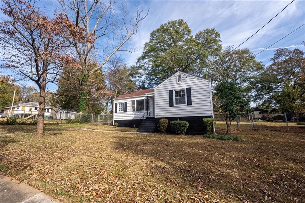 3122 Semmes Street Atlanta, GA 30344 - Photo 5 of 33 a front view of a house with a yard